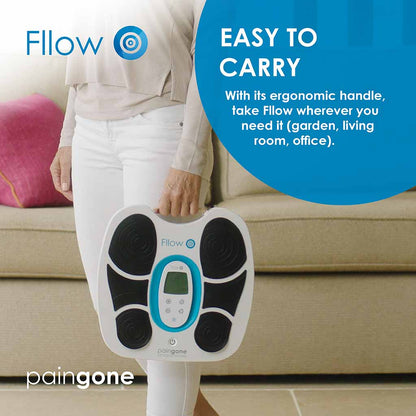 Woman holding the Paingone Fllow device by the ergonomic handle to show how easy to carry it is 