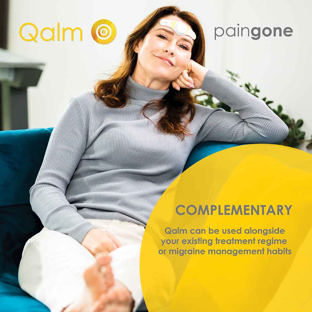Woman using Paingone Qalm while on the sofa with the message of "Qalm can be used alongside your existing treatment regime or migraine management habits."